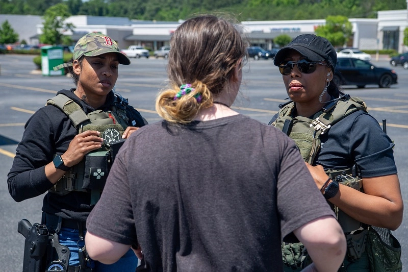 Female Deputy Us Marshals Talking to a witness