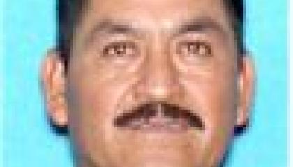 Face photo of male fugitive Dionicio Martinez