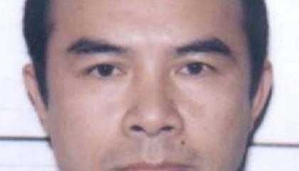 Face photo of male fugitive Tan Vuong Do