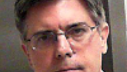 Face photo of male fugitive Buck Stratton Flinn