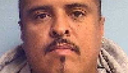 Face photo of male fugitive Ernest Madrid