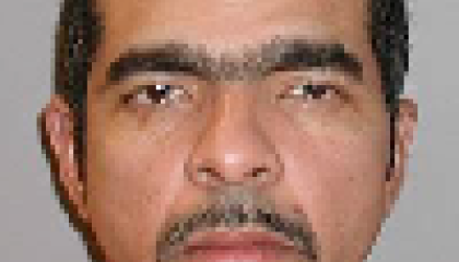 Face photo of male fugitive Perez Maximo