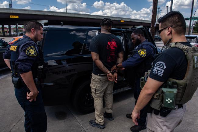 Police Officers arresting a fugitive during Operation North…