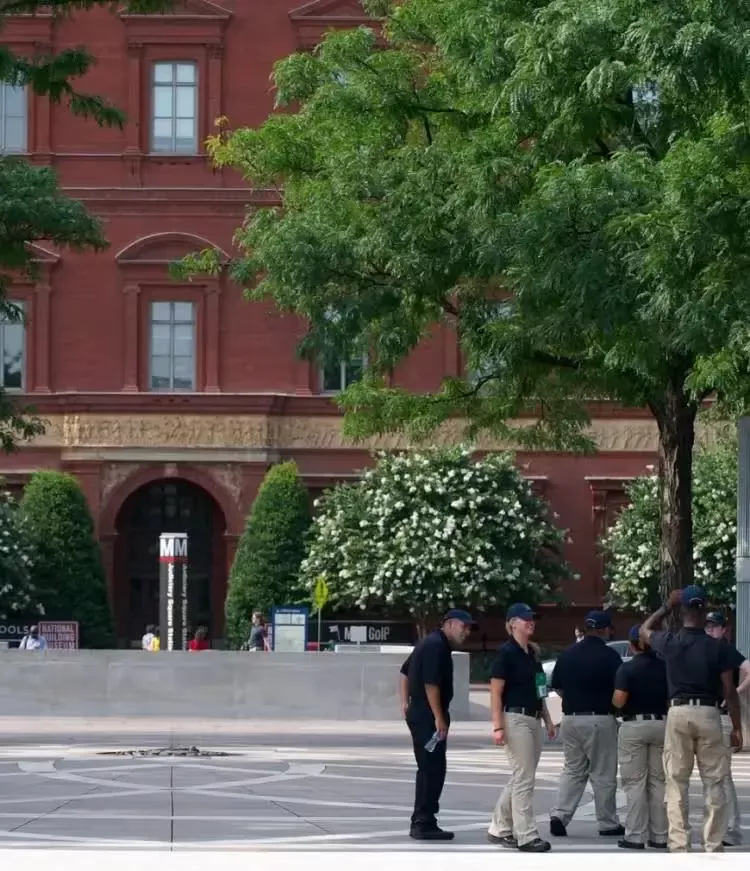 Police officers in front of a building