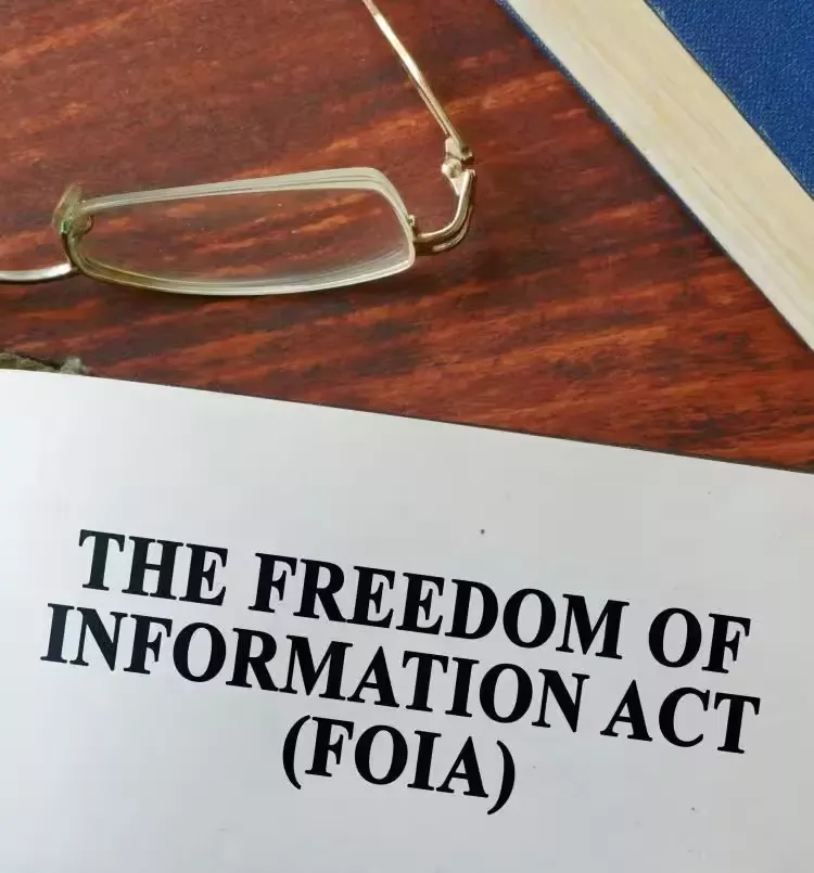 A pair of glasses and a paper